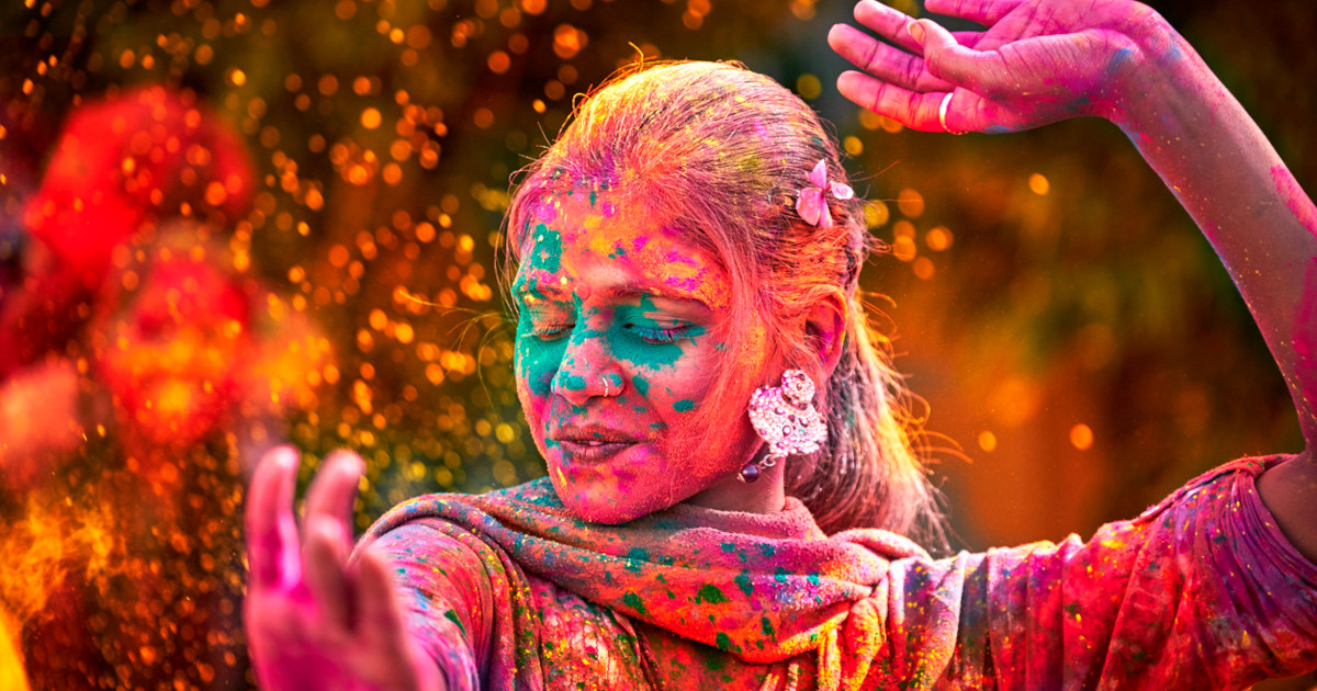 Woman Dances on Holi, happy for her new coupon.