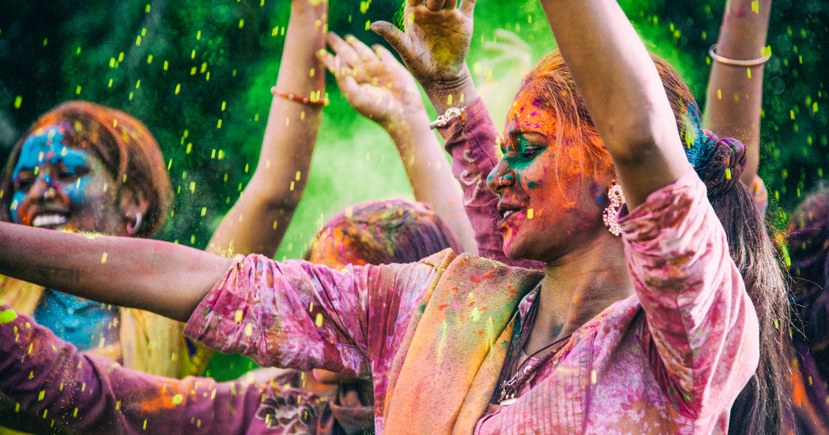 Happy woman, preparing to take their saris to the dry cleaners.